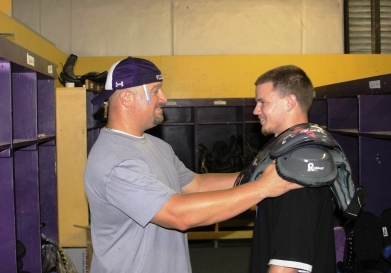 Coach Kaklis Hands Out Equipment